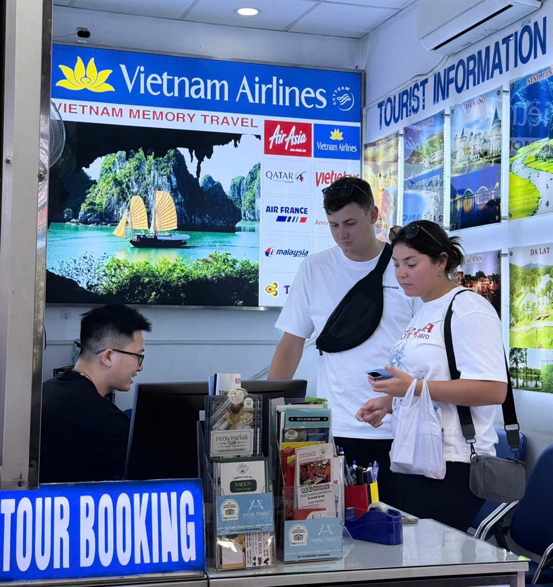 Helping travelers at our tour booking counter